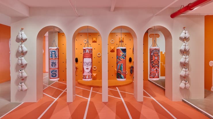 Boxing bags printed with Hermès scarf motifs at the HermèsFit installation in Brooklyn
